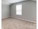 Simple bedroom with neutral walls and carpet at 9931 Cask Way, Huntersville, NC 28078