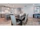 Modern dining area with gray upholstered chairs and a sleek dining table at 9931 Cask Way, Huntersville, NC 28078