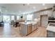 Open concept kitchen features a large island and stainless steel appliances at 9931 Cask Way, Huntersville, NC 28078