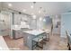 Spacious kitchen with gray cabinets, white countertops and island seating at 9931 Cask Way, Huntersville, NC 28078