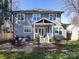 Exterior view showcasing a well-kept backyard with a dining patio and the house's design at 1012 Rockway Dr, Charlotte, NC 28205
