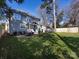Large, beautifully landscaped backyard with a patio dining set and well-maintained lawn at 1012 Rockway Dr, Charlotte, NC 28205