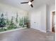 Bedroom with a large window and a custom mural on the wall at 1012 Rockway Dr, Charlotte, NC 28205