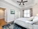 Bedroom with a king-size bed, large windows with curtains, and access to another room at 1012 Rockway Dr, Charlotte, NC 28205