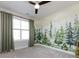 Bedroom with a large window and a custom mural on the wall at 1012 Rockway Dr, Charlotte, NC 28205