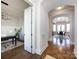 Hallway featuring herringbone-patterned wood floors and leading to a dining room and office at 1012 Rockway Dr, Charlotte, NC 28205