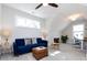 Bright living room featuring vaulted ceilings, modern furniture and a ceiling fan at 1012 Rockway Dr, Charlotte, NC 28205
