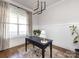 Bright office space with a large window, modern lighting, and classic wainscoting at 1012 Rockway Dr, Charlotte, NC 28205