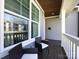 Cozy porch with dark wood flooring and white trim, perfect for relaxing outdoors at 1012 Rockway Dr, Charlotte, NC 28205