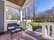 Inviting covered porch with outdoor seating, leading to a spacious fenced backyard at 1012 Rockway Dr, Charlotte, NC 28205