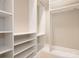 Walk-in closet featuring white shelves and closet rods at 11611 Brachetto Pl, Charlotte, NC 28277