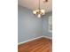 Simple dining room with hardwood floors and chandelier at 11837 Shoemaker Ct, Charlotte, NC 28270