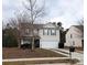 Two-story house with gray siding, attached garage, and landscaping at 13926 Lawrence Farm Ln # L49, Charlotte, NC 28278