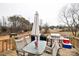 Relaxing deck with seating area, grill, and view of the backyard at 17154 Frog Pond Rd, Oakboro, NC 28129