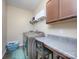 Convenient laundry room with washer, dryer, and folding counter at 2605 Andes Dr, Statesville, NC 28625