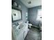 Updated bathroom features marble countertop, framed mirror, ceramic tile, and fresh paint at 2801 Cowles Rd, Charlotte, NC 28208