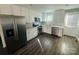 Newly remodeled kitchen with stainless steel appliances, modern fixtures, granite countertops, and freshly painted walls at 2801 Cowles Rd, Charlotte, NC 28208