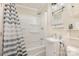 Clean bathroom with a shower/tub combo, gray and white striped shower curtain at 313 Webb St # 88, Albemarle, NC 28001