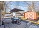 Outdoor patio with table, chairs, and storage shed at 313 Webb St # 88, Albemarle, NC 28001