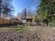 Backyard with chicken coop and fenced enclosure at 3315 Eastwood Dr, Charlotte, NC 28205