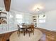 Bright dining area with wood floors, a round table, and built-in shelving at 3315 Eastwood Dr, Charlotte, NC 28205