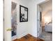 Hallway with access to bathroom and bedroom, featuring framed photos at 3315 Eastwood Dr, Charlotte, NC 28205