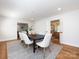 Open concept dining room leading to other rooms, featuring a modern table and stylish chairs at 7037 Wrentree Dr, Charlotte, NC 28210