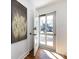 Bright entryway with hardwood floors and natural light, leading into the home's interior at 7037 Wrentree Dr, Charlotte, NC 28210