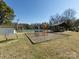 A colorful playground featuring climbing structures and a picnic shelter, perfect for Gathering fun and outdoor activities at 7037 Wrentree Dr, Charlotte, NC 28210