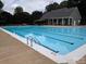 Community swimming pool with a bathhouse at 9408 Holly Bend Ln, Huntersville, NC 28078