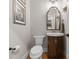 Elegant powder room features a pedestal sink, toilet and decorative mirror at 1740 Withers Dr, Denver, NC 28037