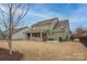 Green home with a large backyard and covered patio, great for entertaining at 17611 Austins Creek Dr, Charlotte, NC 28278