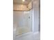 Modern bathroom featuring a glass-enclosed shower with white tile and a built-in bench at 17611 Austins Creek Dr, Charlotte, NC 28278