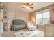 Charming Bedroom featuring a crib, accent wallpaper, and natural light from the window at 17611 Austins Creek Dr, Charlotte, NC 28278