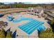 Aerial view of the community pool featuring a waterslide, area, and large pool at 17611 Austins Creek Dr, Charlotte, NC 28278