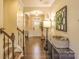 Foyer with hardwood floors, staircase, and neutral-colored walls at 17611 Austins Creek Dr, Charlotte, NC 28278