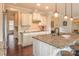 Bright kitchen featuring granite countertops, an island, modern cabinets, and stainless steel appliances at 17611 Austins Creek Dr, Charlotte, NC 28278