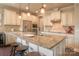 Modern kitchen featuring a granite island, stainless steel appliances, and custom cabinetry at 17611 Austins Creek Dr, Charlotte, NC 28278