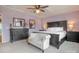 Comfortable, carpeted main bedroom with a ceiling fan, dark furniture, and ample natural light at 17611 Austins Creek Dr, Charlotte, NC 28278