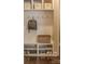 Mudroom with built-in shelving, hooks, a bench, and storage for shoes and accessories at 17611 Austins Creek Dr, Charlotte, NC 28278
