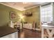 Home office with hardwood floors, green walls, a decorative shelf, and ample desk space at 17611 Austins Creek Dr, Charlotte, NC 28278
