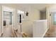 Upstairs hallway with light walls and wood-look flooring at 1870 Lillywood Ln, Fort Mill, SC 29707