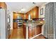 Modern kitchen with granite countertops and wood cabinets at 1870 Lillywood Ln, Fort Mill, SC 29707