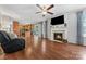 Living room with hardwood floors, fireplace, and open floor plan at 1870 Lillywood Ln, Fort Mill, SC 29707