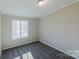 Simple bedroom with gray carpet and a large window at 2379 Justin Dr, York, SC 29745