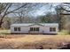 White manufactured home with green metal roof and small front porch at 2379 Justin Dr, York, SC 29745