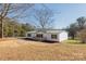 White single-wide mobile home with green metal roof; large yard at 2379 Justin Dr, York, SC 29745