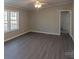 Large living room with wood-look floors and neutral walls at 2379 Justin Dr, York, SC 29745