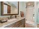 Bathroom boasting granite countertop vanity and tiled walk-in shower at 3042 Kings Manor Dr, Weddington, NC 28104