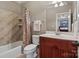 Bathroom featuring neutral toned walls, a combined bath and shower, and a single vanity at 3042 Kings Manor Dr, Weddington, NC 28104